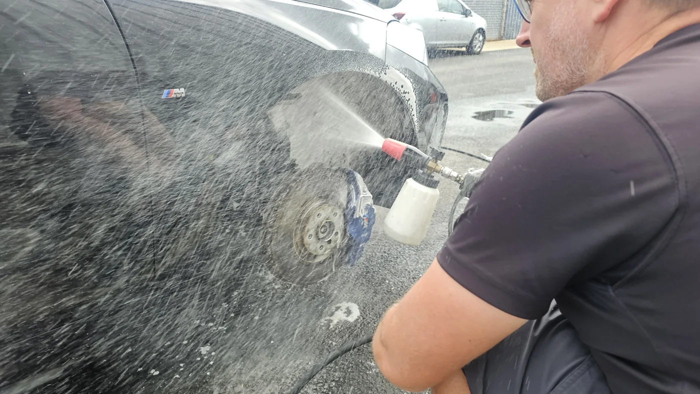 A wheel being rinsed during cleaning